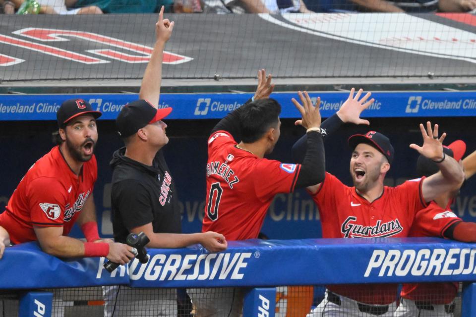 The Guardians celebrate in the dugout after a home run by Jhonkensy Noel during the third inning against the Rangers, Aug. 24, 2024, in Cleveland.