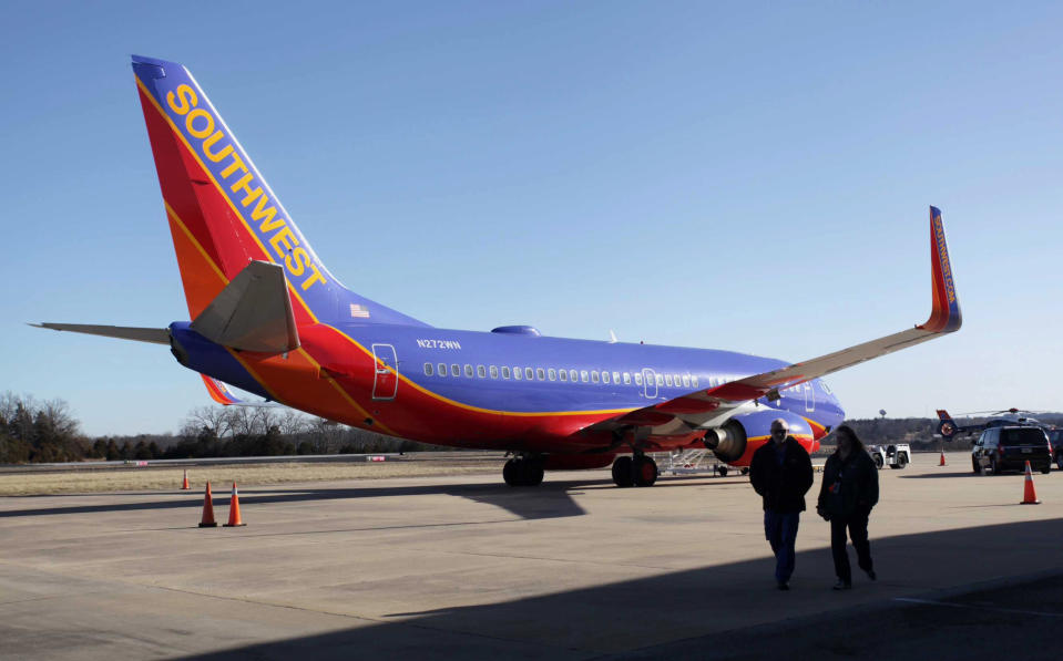 FILE - In this Jan. 13, 2014 file photo, Southwest Airlines Flight 4013 sits at the M. Graham Clark Downtown Airport in Hollister, Mo. On nearly 150 flights, U.S. commercial air carriers have either landed at the wrong airport or started to land and realized their mistake in time, according to a search by The Associated Press of government safety databases and media reports since the early 1990s. (AP Photo/Springfield News-Leader, Valerie Mosley, File)