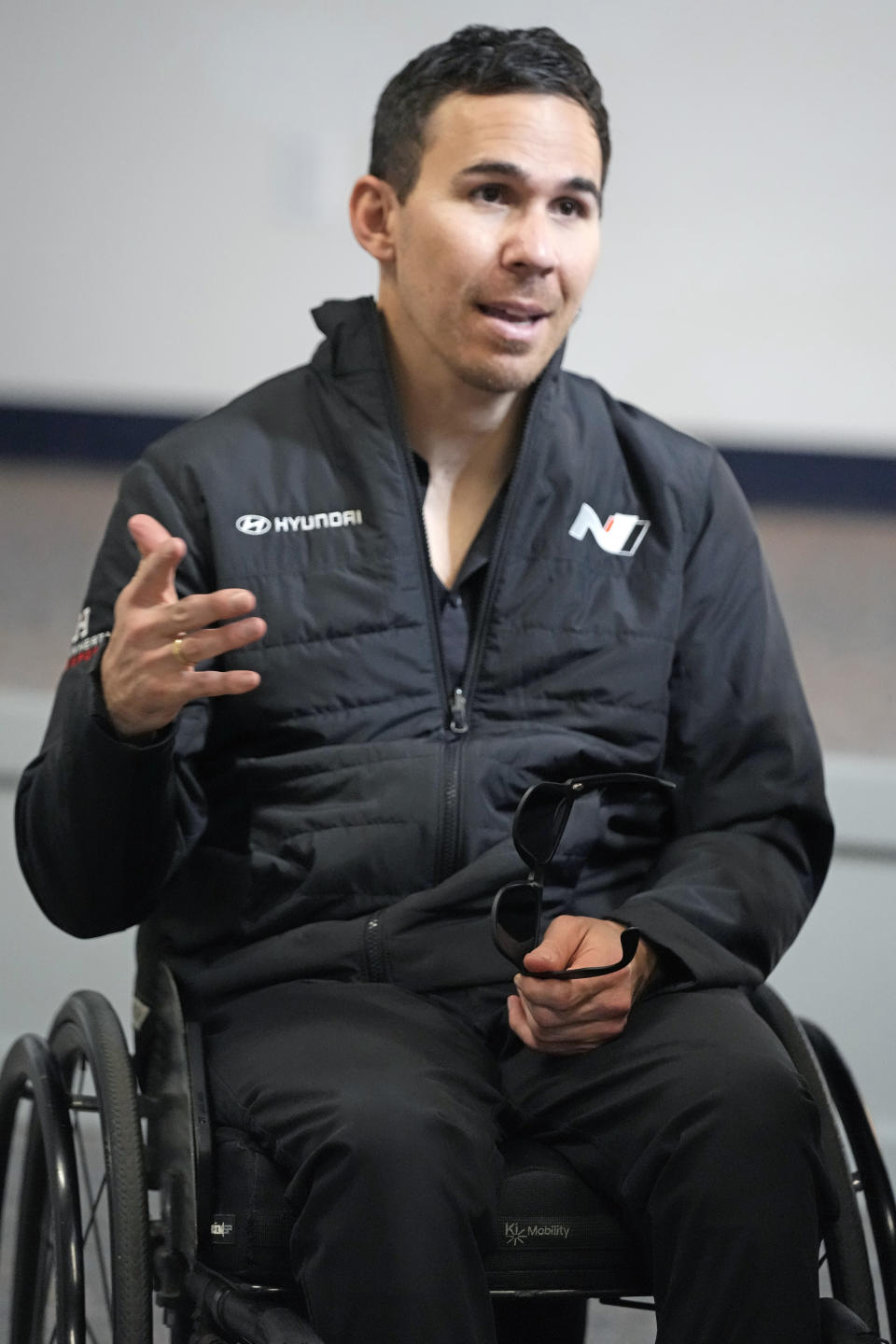 FILE - Paralyzed former IndyCar driver Robert Wickens answers questions during an interview prior to the Rolex 24 hour auto race at Daytona International Speedway, Thursday, Jan. 26, 2023, in Daytona Beach, Fla. Wickens is the championship leader headed into Friday's Michelin Pilot Challenge season finale at Road Atlanta in Braselton, Georgia. (AP Photo/John Raoux, File)