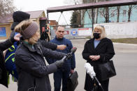 Russian opposition leader Alexei Navalny's lawyers Olga Mikhailova, right, and Vadim Kobzev, second right, speak to the media in front of the penal colony where a hospital for convicts located in Vladimir, a city 180 kilometers (110 miles) east of Moscow, Russia, Tuesday, April 20, 2021. Several doctors have been prevented from seeing Russian opposition leader Alexei Navalny at a prison hospital after his three-week hunger strike. Prosecutors, meanwhile, detailed a sweeping, new case against his organization. Navalny was transferred Sunday from a penal colony east of Moscow to a prison hospital in Vladimir, east of the capital, and his lawyers and associates have said that his condition has dramatically worsened. Reports about his rapidly deteriorating health has drawn international outrage. (AP Photo/Kirill Zarubin)