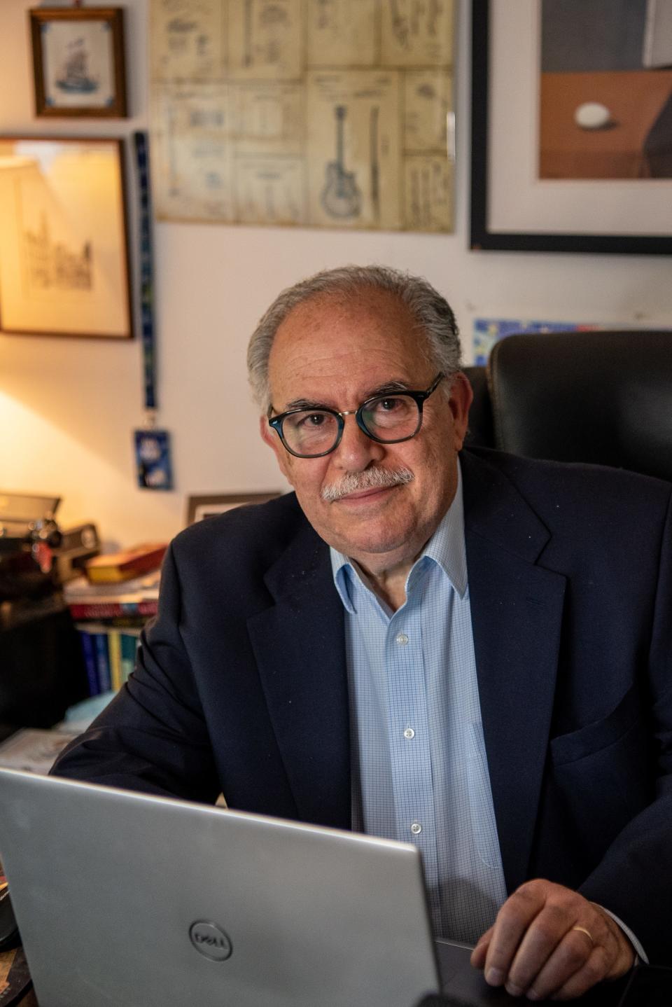 Eli Amdur, shown in his Teaneck office, has been writing a column in The Record offering career advice since 2001.