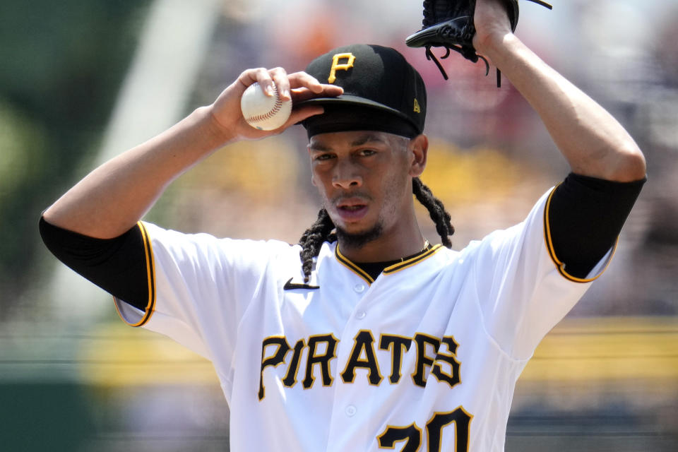 Pittsburgh Pirates starting pitcher Osvaldo Bido adjusts his cap between hitters during the first inning of a baseball game against the San Francisco Giants in Pittsburgh, Sunday, July 16, 2023. (AP Photo/Gene J. Puskar)