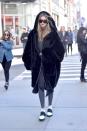 <p>Hadid looked cozy hitting the streets of New York, topping her black + white athleisure look with an oversized furry coat. </p>