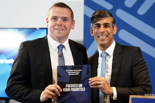 Douglas Ross and Rishi Sunak holding manifesto document