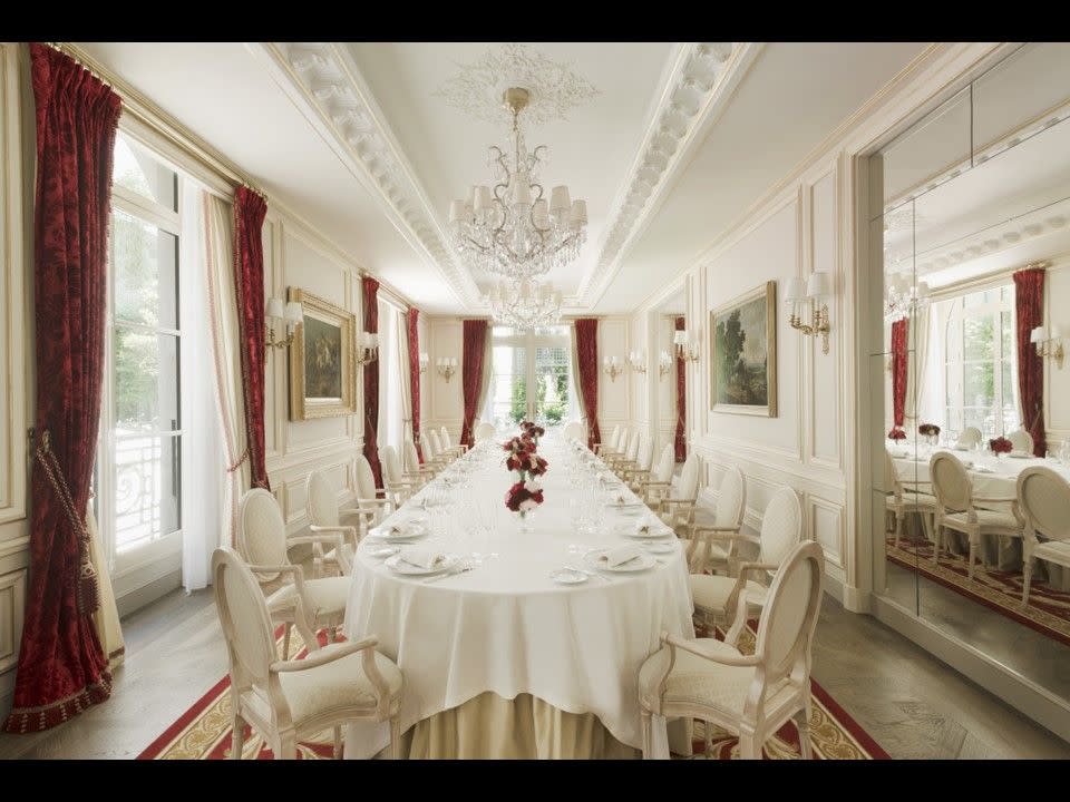 a white dining room area in the ritz paris