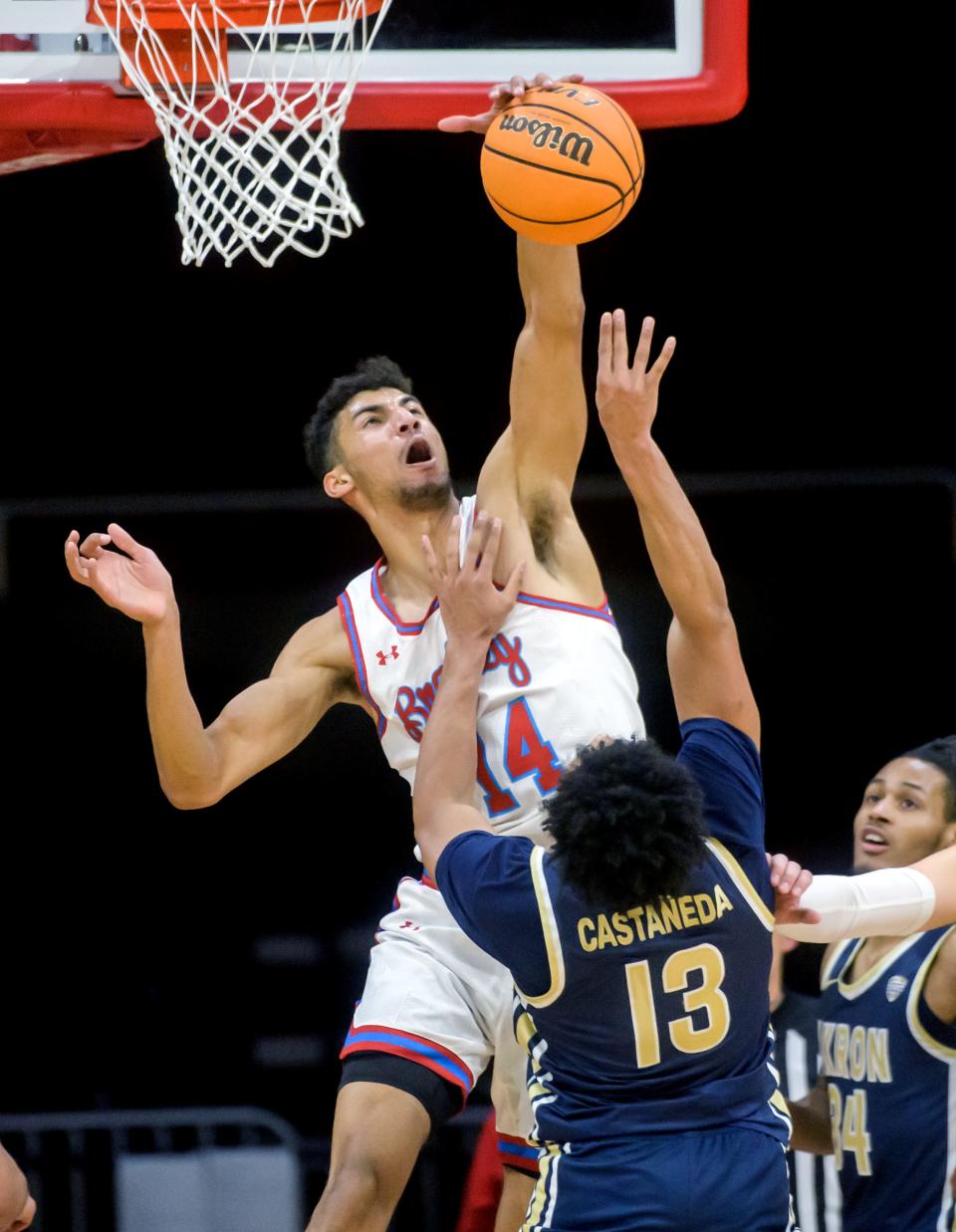 Bradley's Malevy Leons (24) blocks a shot by Akron's Xavier Castaneda in the second half Thursday, Dec. 22, 2022 at Carver Arena. The Braves crushed the Zips 74-55.