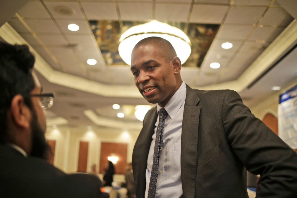 The Democratic candidate for New York's 19th District, Antonio Delgado, speaks to people after a candidate forum in Poughkeepsie, N.Y., Wednesday, Oct. 17, 2018. Hip-hop, health care and Brett Kavanaugh have emerged as issues in a too-close-to-call congressional race in New York’s Hudson Valley that pits the freshman Republican congressman against a rapper-turned-corporate lawyer seeking his first political office. (AP Photo/Seth Wenig)