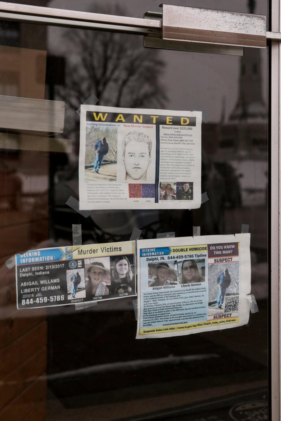 Wanted posters with the latest sketches of the suspected killer of Abby Williams and Libby German hang in the store front of a Washington Street business, Wednesday, Feb. 10, 2021 in Delphi. Abby Williams and Libby German, both Delphi eighth-graders, were murdered while hiking a popular community trail near Delphi on Feb. 13, 2017.