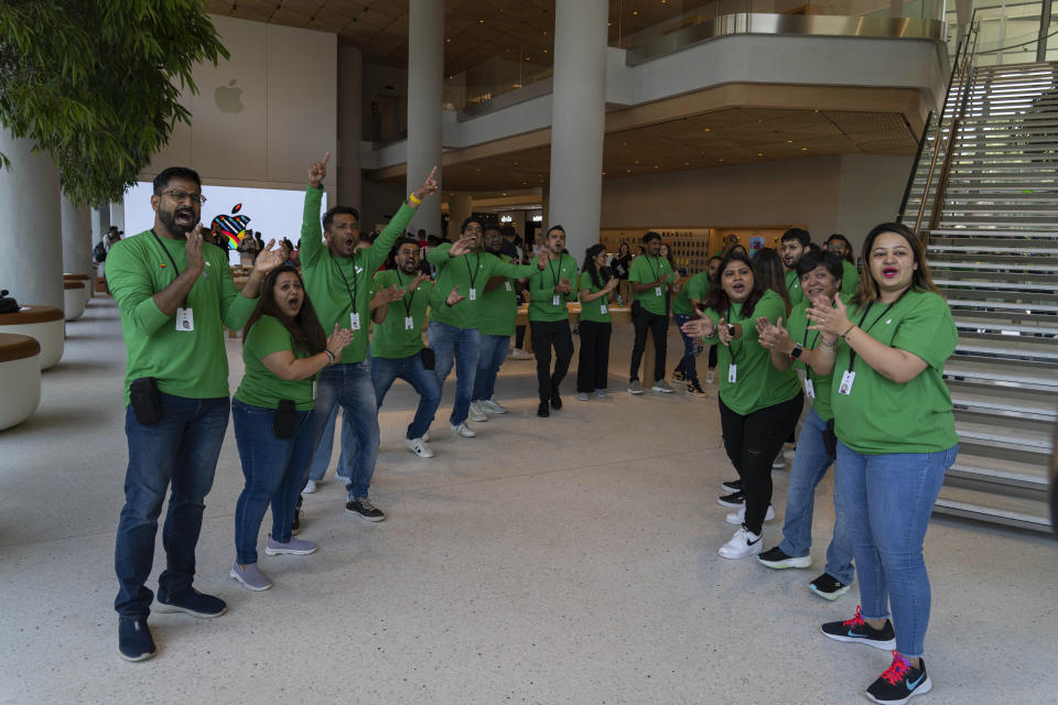 Apple retail employees applaud at the beginning of a press preview of India's first Apple Store in Mumbai, India, Monday, April 17, 2023. Apple will open its first retail store in India in Mumbai on Tuesday. (AP Photo/Rafiq Maqbool)