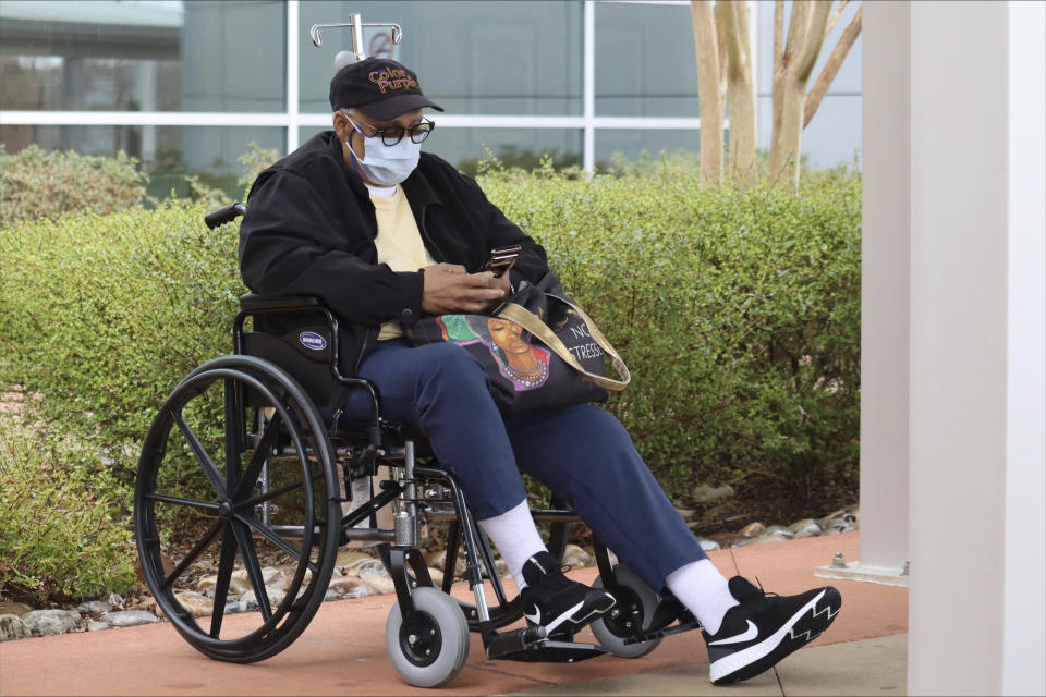 Sandra Williams waits for her ride outside a Department of Veterans Affairs health center in Charlotte, N.C., on Friday, March 1, 2024. Recent statements by Donald Trump have fueled Democrats' sense that there's an opening among voters with strong military ties, and progressive veterans' organizations are working to bridge the gap with what has long been a reliably red constituency. (AP Photo/James Pollard)