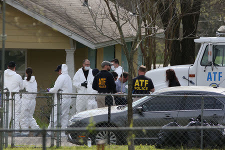 Law enforcement personnel investigate the home where Austin serial bomber Mark Anthony Conditt lived in Pflugerville, Texas, U.S., March 22, 2018. REUTERS/Loren Elliott