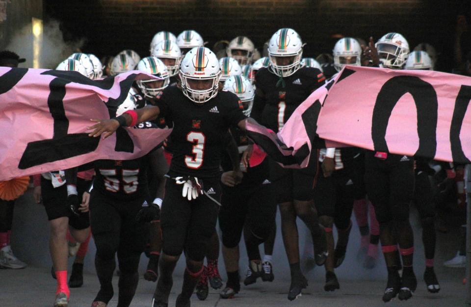 Mandarin defensive back Antoine Belgrave-Shorter (3) leads the team onto the field for a high school football game against Sandalwood on October 27, 2022. [Clayton Freeman/Florida Times-Union]