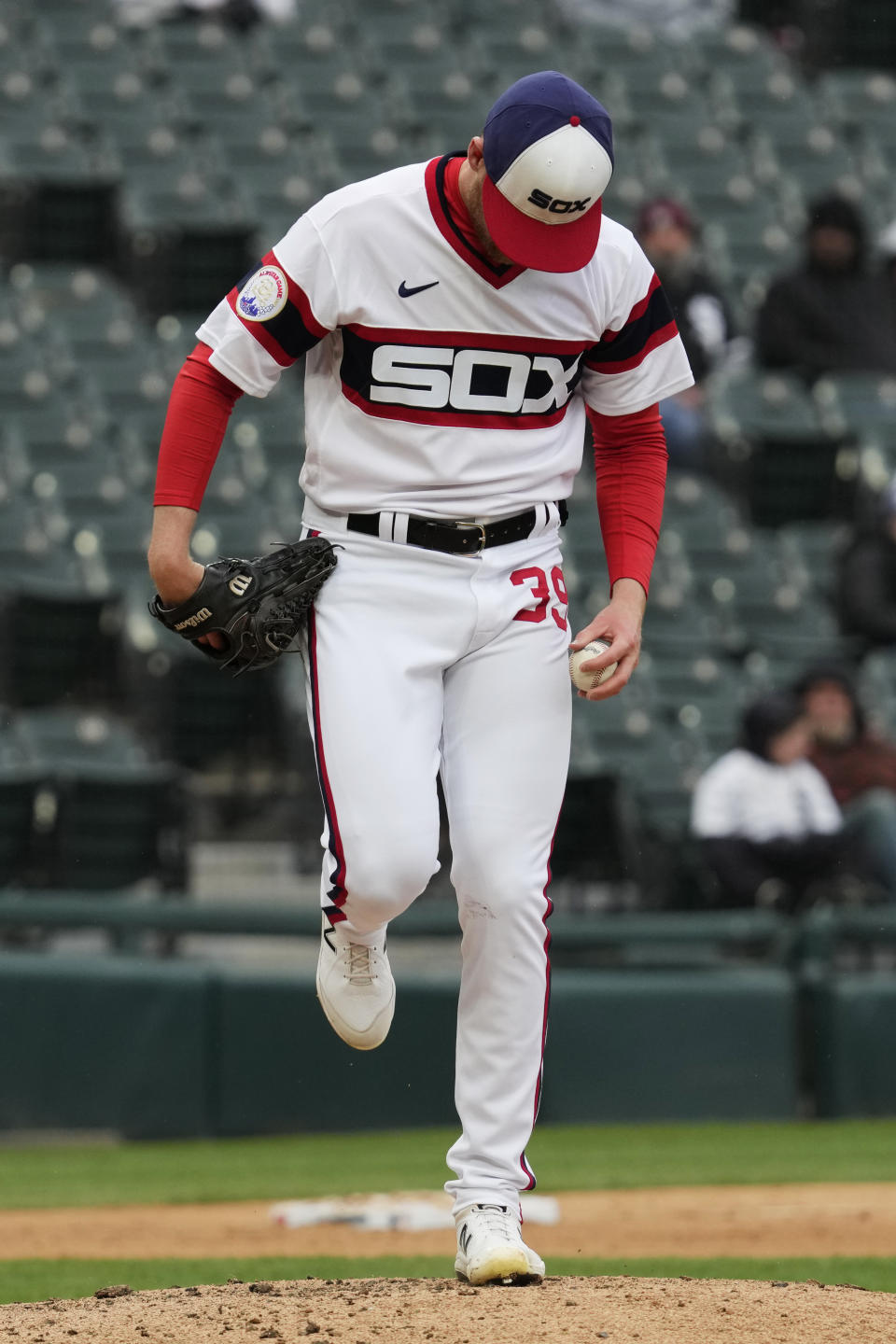 Chicago White Sox relief pitcher Aaron Bummer kicks the mound during the eighth inning of a baseball game against the Baltimore Orioles in Chicago, Sunday, April 16, 2023. (AP Photo/Nam Y. Huh)