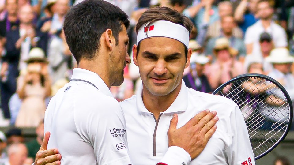 Roger Federer (pictured right) congratulating Novak Djokovic (pictured left) at the net after their Wimbledon match.