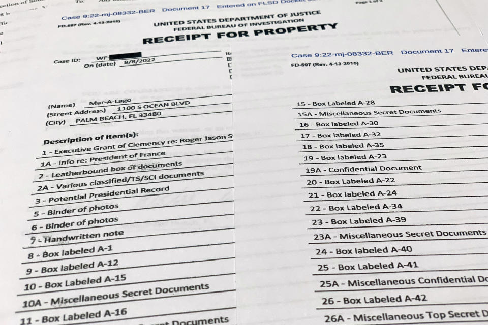 The receipt for property that was seized during the execution of a search warrant by the FBI at former President Donald Trump's Mar-a-Lago estate in Palm Beach, Fla., is photographed Friday, Aug. 12, 2022. (AP Photo/Jon Elswick)