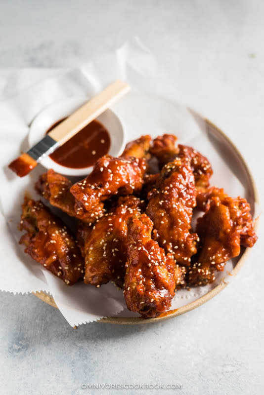 <p>Omnivorescookbook</p><p>A delicious Asian-American marriage: triple-crunch crispy fried chicken wings tossed in a sticky, spicy Asian sauce. The wings stay crispy even when they’re no longer hot! </p><p><strong>Get the recipe: <a href="http://omnivorescookbook.com/fried-chicken-wings-asian-hot-sauce/" rel="nofollow noopener" target="_blank" data-ylk="slk:Fried Chicken Wings In Asian Hot Sauce;elm:context_link;itc:0;sec:content-canvas" class="link ">Fried Chicken Wings In Asian Hot Sauce</a></strong></p>