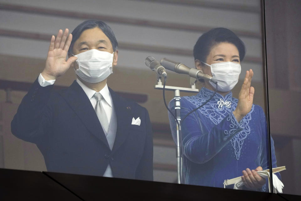 Japan's Emperor Naruhito, with Empress Masako, waves towards well-wishers as he appears on the balcony of the Imperial Palace to mark the emperor's 63rd birthday in Tokyo Thursday, Feb. 23, 2023. (AP Photo/Eugene Hoshiko, Pool)