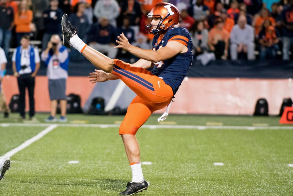 FILE - In this Sept. 9, 2017, file photo, Illinois punter Blake Hayes (14) punts the ball during an NCAA college football game against Western Kentucky, in Champaign, Ill. The Big Ten Conference knows the value of having good punters, and they are sometimes willing to go a long way to get them. Hayes is a former Australian rules football player who trained at ProKick Australia before coming to the United States.  (AP Photo/Bradley Leeb, File)