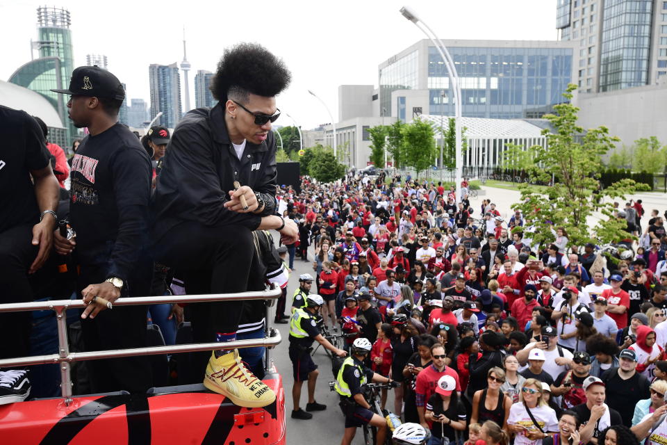 Toronto Raptors guard Danny Green smokes a cigar as he celebrates during the 2019 Toronto Raptors Championship parade in Toronto on Monday, June 17. (Photo by The Canadian Press/Frank Gunn)