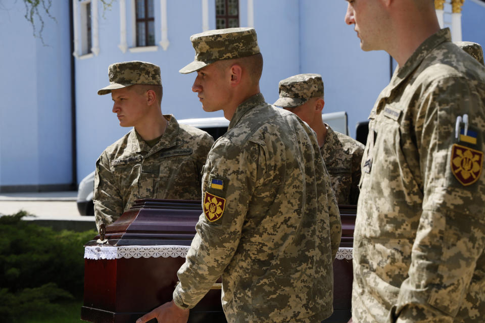 Ukrainian servicemen attend a farewell ceremony for U.S. volunteer soldier Christopher James Campbell in Kyiv, Ukraine, Friday, May 5, 2023. Campbell was a member of the International Legion and ex-soldier of the U.S. 82nd Airborne Division. He recently died in Bakhmut during fightings against Russian forces. (AP photo/Alex Babenko)