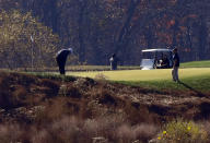 TOPSHOT - US President Donald Trump (L) golfs at Trump National Golf Club on November 7, 2020 in Sterling, Virginia. - Democrat Joe Biden has won the White House, US media said November 7, defeating Donald Trump and ending a presidency that convulsed American politics, shocked the world and left the United States more divided than at any time in decades. (Photo by Olivier DOULIERY / AFP) (Photo by OLIVIER DOULIERY/AFP via Getty Images)