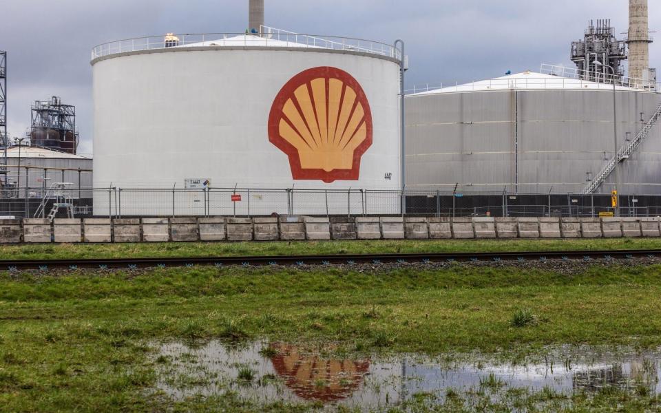 Oil storage silos beyond waterlogged land at the Shell Pernis refinery in Rotterdam earlier this month