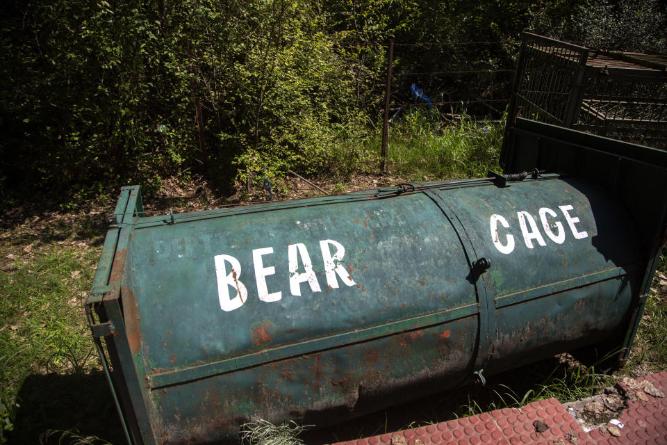An empty bear cage is seen at the Dachigam National Park on the outskirts of Srinagar, Indian controlled Kashmir, Saturday, Sept. 12, 2020. Amid the long-raging deadly strife in Indian-controlled Kashmir, another conflict is silently taking its toll on the Himalayan region's residents: the conflict between man and wild animals. According to official data, at least 67 people have been killed and 940 others injured in the past five years in attacks by wild animals in the famed Kashmir Valley, a vast collection of alpine forests, connected wetlands and waterways known as much for its idyllic vistas as for its decades-long armed conflict between Indian troops and rebels. (AP Photo/Mukhtar Khan)