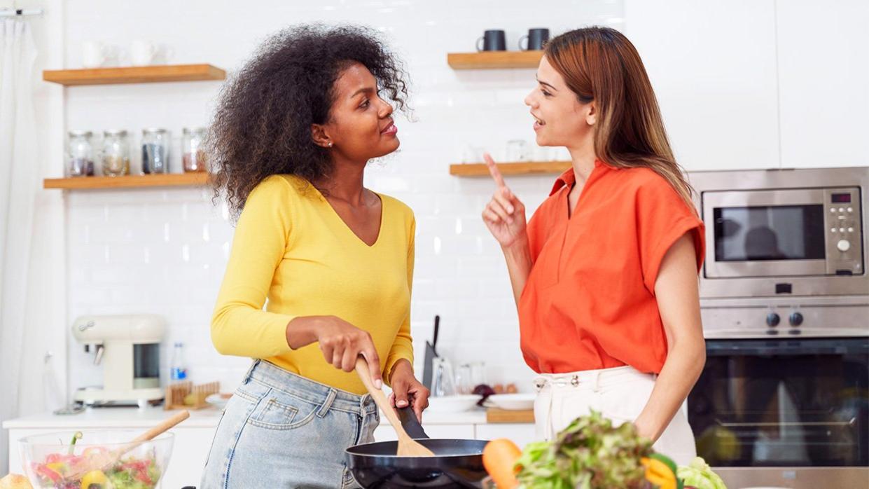 Diverse LGBTQ+ Couple Cooking Together