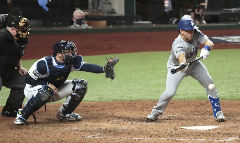 The Dodgers' Austin Barnes lays down a fourth-inning sacrifice bunt that brought in a run in Game 3 of the World Series.