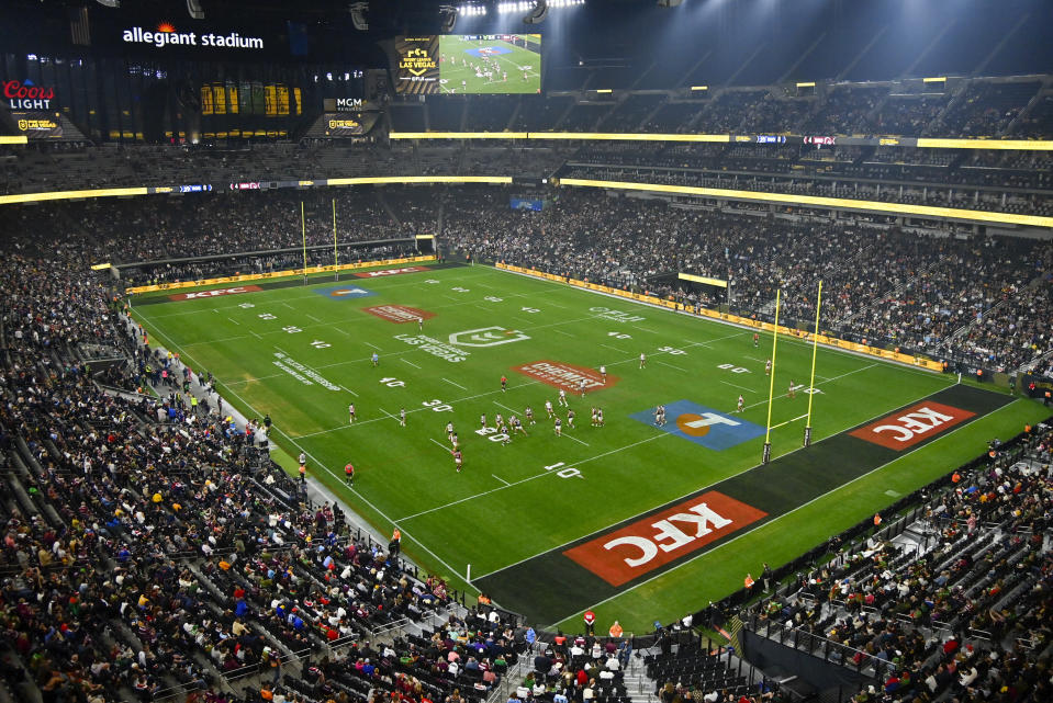 Spectators watch the NRL match between the Sydney Roosters and the Brisbane Broncos at Allegiant Stadium in Las Vegas, Saturday, March 2, 2024. (AP Photo/David Becker)