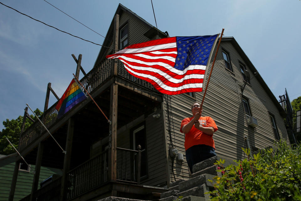 Kate Lynn Blatt, a transgender woman, waves the U.S. flag outside her home in Pottsville, Pennsylvania, on May 25, 2016. Blatt once lived as a woman at home but went to work in a battery factory as a man -- a painful phase in her gender transition that would later propel her to the forefront of a constitutional battle for transgender rights in America. She decided to start over, interviewing as a woman for a new job with the outdoor equipment and apparel retail chain Cabela's Inc (CAB.N), landing the position, and finally leaving her life as a male behind. A six-year transition, starting from when she graduated high school, was finally over. "Oh my God, it was the most liberating thing I've ever experienced in my entire life," Blatt said in an interview in her hometown. "And then slam," she said, smacking a fist into her palm. "Employee discrimination."