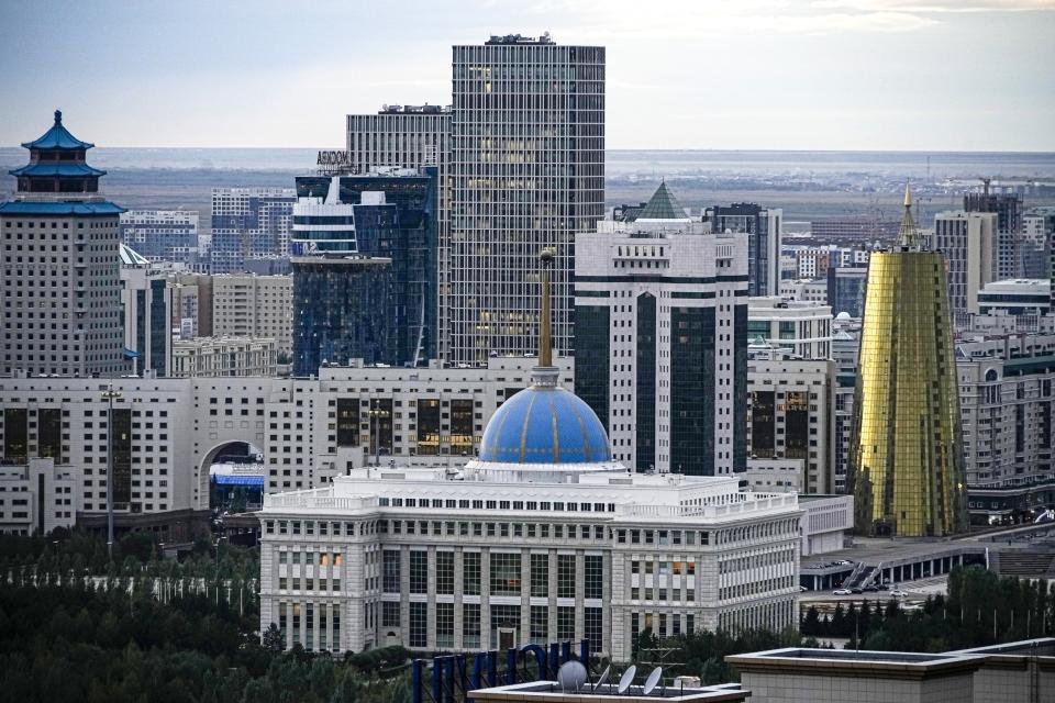 FILE - A view of the of Astana, former name Nur-Sultan, the capital of Kazakhstan with at the Presidential Palace in the center, on Monday, Sept. 12, 2022. The snap election notably comes on the third anniversary of the resignation as president of Nursultan Nazarbayev, who had led Kazakhstan since independence following the breakup of the Soviet Union in 1991 and had established immense influence. His successor Kassym-Jomart Tokayev was widely expected to continue Nazarbayev's authoritarian course and even renamed the capital as Nur-Sultan in his honor, but Tokayev restored the capital's previous name of Astana, and the parliament repealed a law granting Nazarbayev and his family immunity from prosecution. (AP Photo/Alexander Zemlianichenko, File)