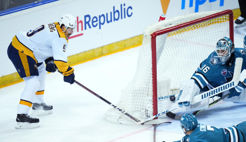 Nashville's Filip Forsberg scores his sides second goal past San Jose's goaltender Kaapo Kahkonen during the NHL hockey game between San Jose Sharks and Nashville Predators played in Prague, Czech Republic, Saturdday, Oct. 8, 2022. (AP Photo/Petr David Josek)