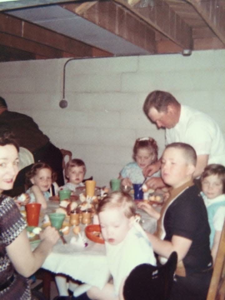 Robert Koeckenberg serves Easter breakfast in his family's basement in the late 1960s. 2024 marks the family's 100th annual Easter breakfast.