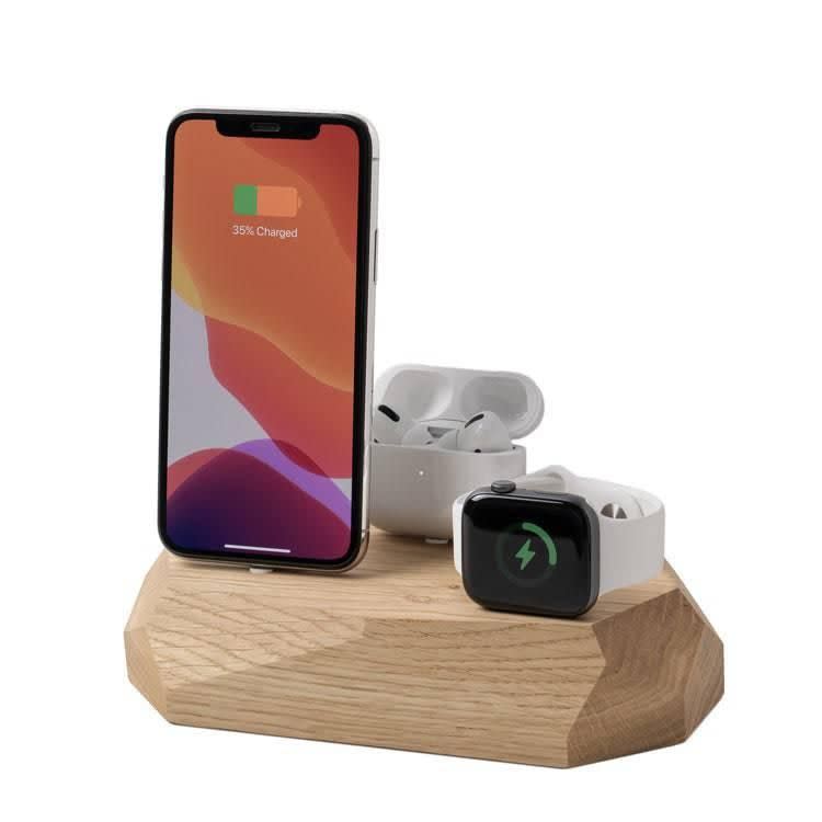 <p><strong>Oakywood</strong></p><p>oakywood.shop</p><p><strong>$79.00</strong></p><p>It's an unobtrusive lil block that can sit on their desk and quietly charge all their Apple products. Plus, it's configured so they can just plop their device in place without having to futz with it.</p>