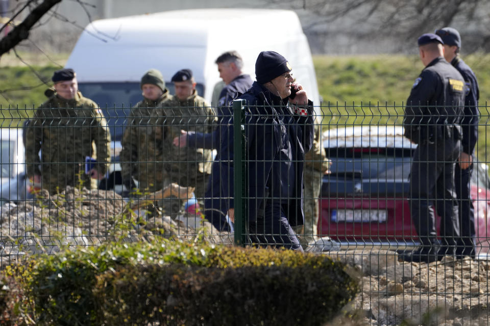 Police inspect site of a drone crash in Zagreb, Croatia, Friday, March 11, 2022. A drone that apparently flew all the way from the Ukrainian war zone crashed overnight on the outskirts of the Croatian capital, Zagreb, triggering a loud blast but causing no injuries, Croatian authorities said Friday. (AP Photo/Darko Bandic)