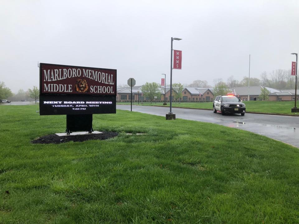 A police car sits in front of the Marlboro Middle School after a bomb threat on Thursday morning April 18,2024