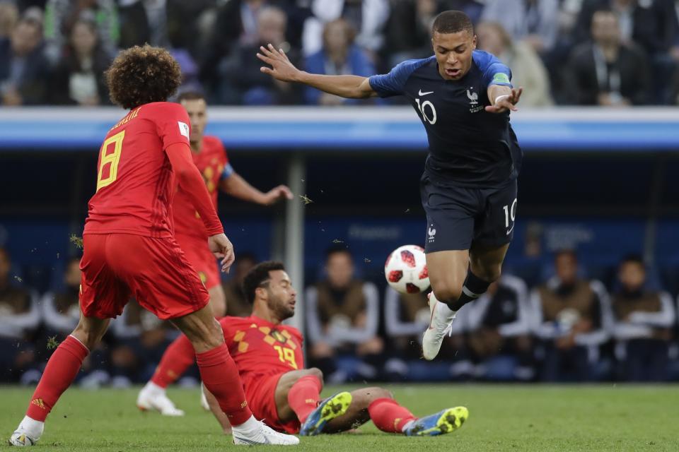 <p>France’s Kylian Mbappe is tackled by Belgium’s Moussa Dembele during the semifinal match between France and Belgium at the 2018 soccer World Cup in the St. Petersburg Stadium, in St. Petersburg, Russia, Tuesday, July 10, 2018. (AP Photo/Petr David Josek) </p>