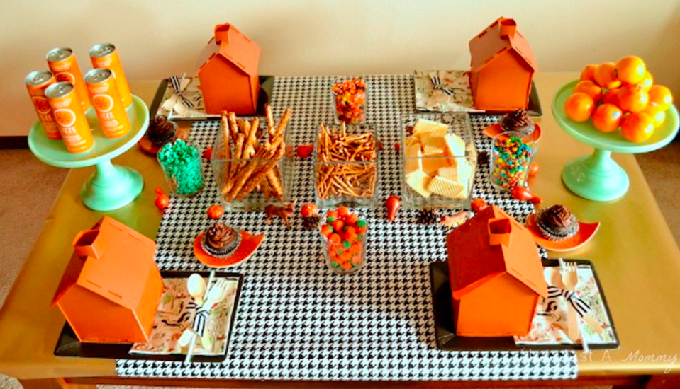 <p>The Celebration Shoppe</p><p>Kids love designing gingerbread houses, so why not let them design a candy and pretzel themed log cabin for Thanksgiving, too? Check out <a href="https://thecelebrationshoppe.com/thanksgiving-kids-table-black-orange-mint-palette/" rel="nofollow noopener" target="_blank" data-ylk="slk:The Celebration Shoppe;elm:context_link;itc:0;sec:content-canvas" class="link "><em>The Celebration Shoppe</em></a> for more details.</p>