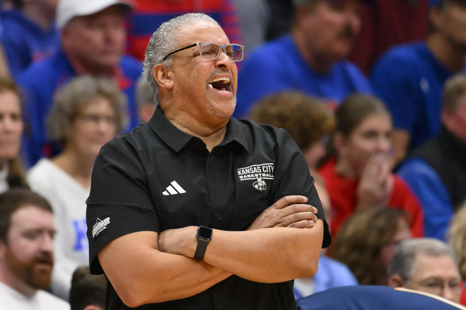 Kansas City coach Marvin Menzies calls out to players during the first half of an NCAA college basketball game against Kansas in Lawrence, Kan., Tuesday, Dec. 5, 2023. (AP Photo/Reed Hoffmann)