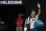 Tennis - Australian Open - Rod Laver Arena, Melbourne, Australia, January 22, 2018. Novak Djokovic of Serbia waves as he leaves after losing against Chung Hyeon of South Korea. REUTERS/Issei Kato