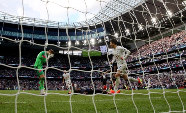 Son Heung-Min (right) celebrates the winner