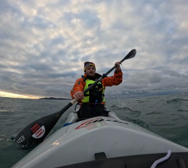 Mike Lambert paddling a kayak