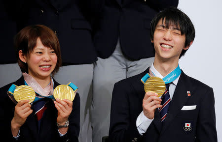 Pyeongchang 2018 Winter Olympics Men's figure skating gold medallist Yuzuru Hanyu (R) and Women's speed skating gold medallist Nana Takagi attend a news conference with other medalists upon their return from the Pyeongchang Winter Games, in Tokyo, Japan, February 26, 2018. REUTERS/Toru Hanai