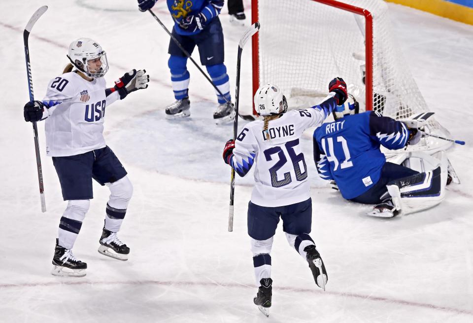 Kendall Coyne (C) of the USA celebrates after scoring a goal in the second period of the Americans’ win over Finland on Sunday. (AP)
