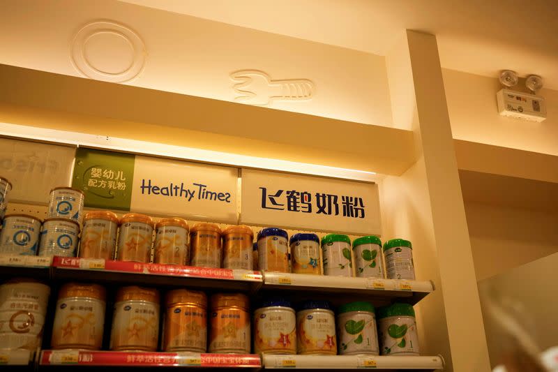 Feihe milk powders are displayed on shelves in a store in Shanghai