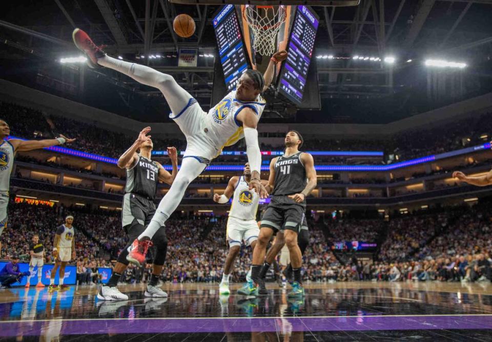 Golden State Warriors forward Jonathan Kuminga takes a dive after driving to the basket during the last regular season home game for the Sacramento Kings on Friday April 7, 2023, at Golden 1 Center.