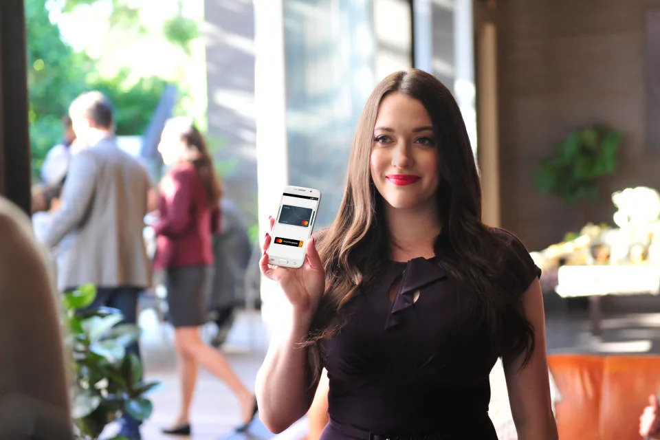 Here’s Kat Dennings rocking a bright lip in her new commercial for MasterCard. Right after she shot this spot, she got a makeover — new bangs that she’s wanted for a decade. (Photo: Michael Simon/startraksphoto.com)