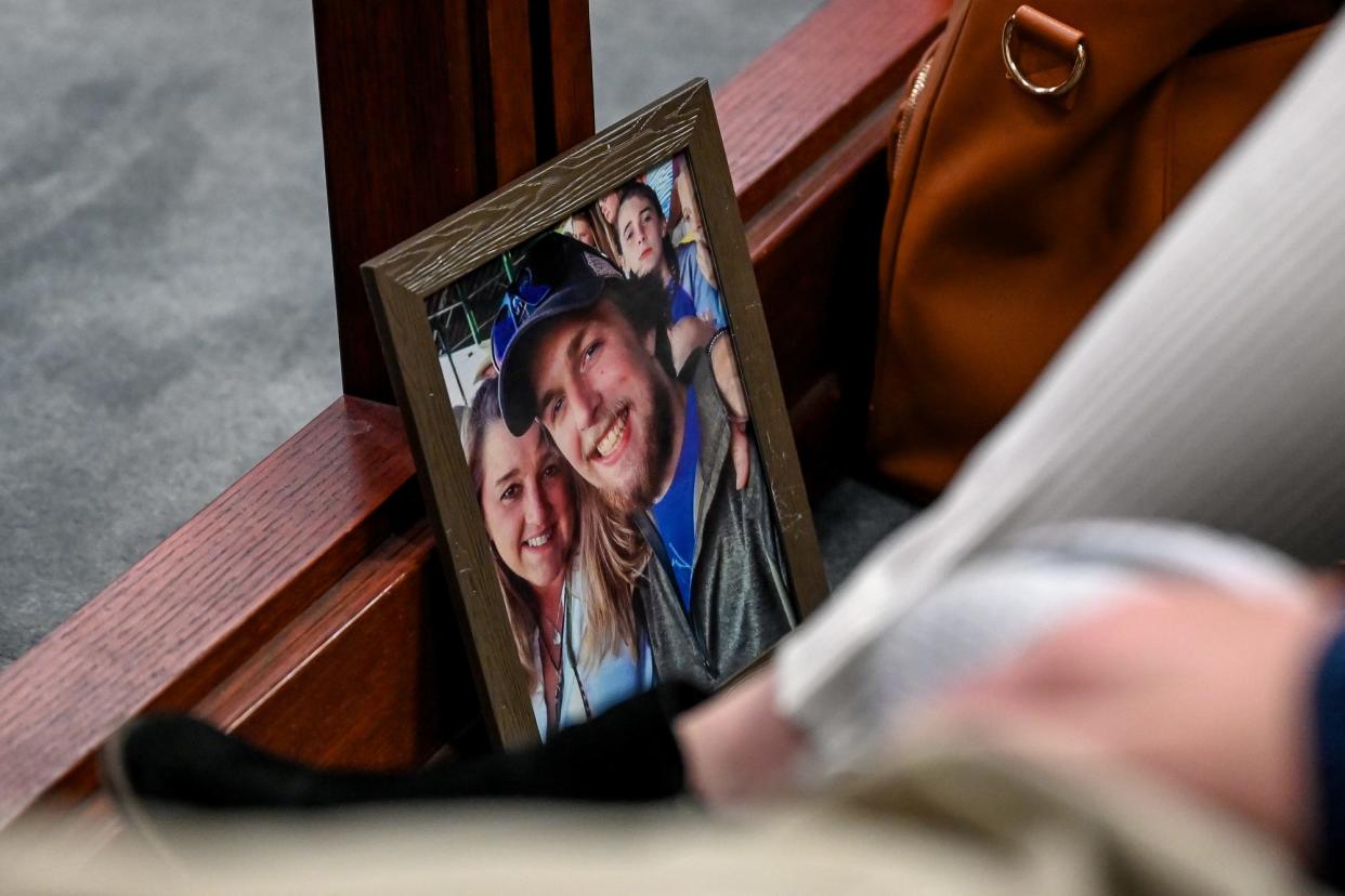 A photo of Joseph Small brought by his family rests on the floor during the Monday, April 4, 2022, trial in Ingham County Circuit Court Judge Clinton Canady III's courtroom in Lansing for the man charged with selling him drugs shortly before his death.