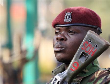 A Kenya General Service Unit policeman stands guard in the area around Westgate shopping mall in Nairobi September 25, 2013. REUTERS/Noor Khamis